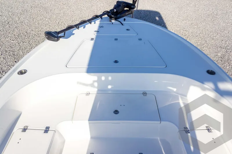 Slide: The Image of 2026 Caymas 26 HB boat deck with storage compartments and trolling motor. - 26