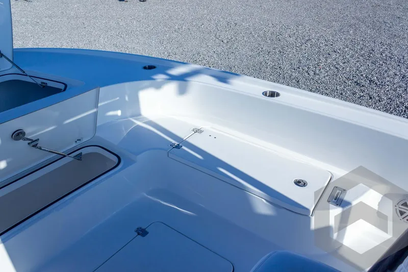 Slide: The Image of 2026 Caymas 26 HB boat interior with storage compartments and sleek design. - 28