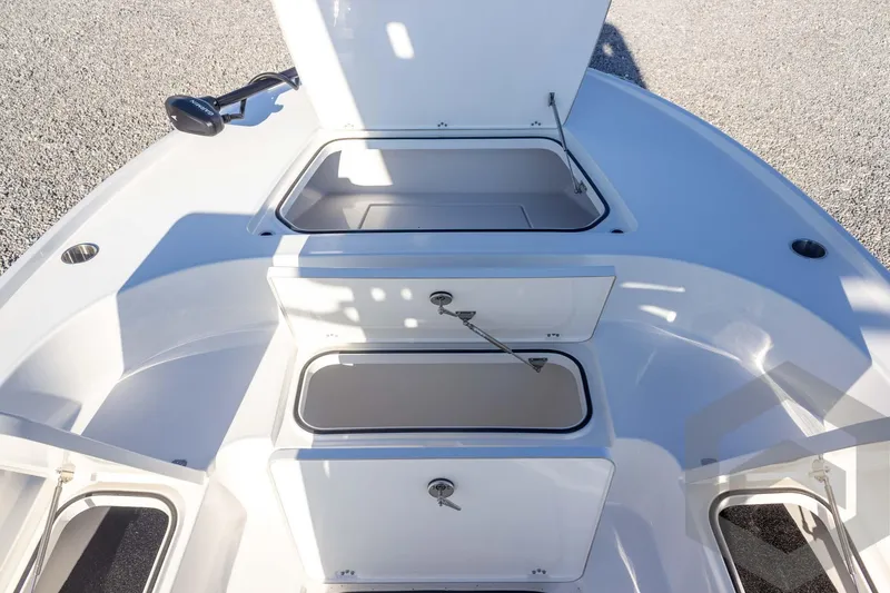 Slide: The Image of 2026 Caymas 26 HB boat storage compartments open on deck. - 29