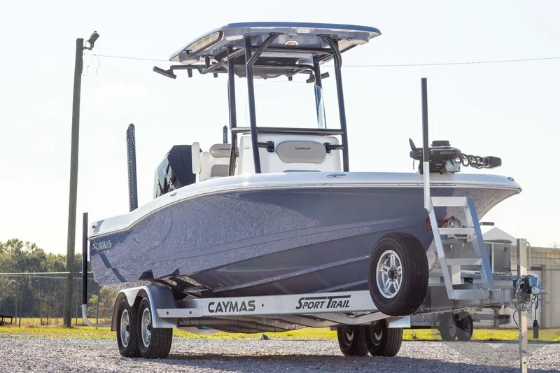 Slide: The Image of 2026 Caymas 26 HB boat on trailer, blue hull, outdoor setting. - 3