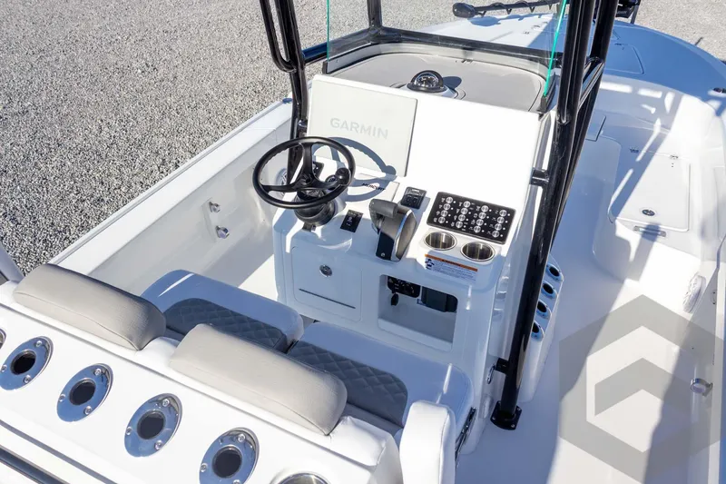 Slide: The Image of 2026 Caymas 26 HB boat cockpit with Garmin navigation and modern controls. - 38