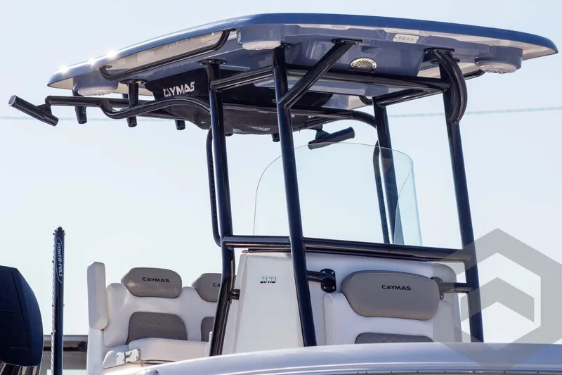 Slide: The Image of 2026 Caymas 26 HB boat with T-top and seating, showcasing modern design. - 4