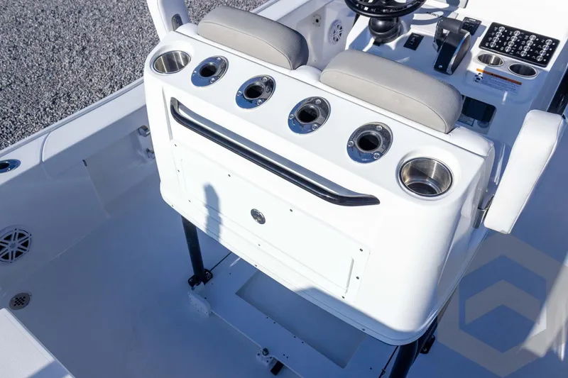 Slide: The Image of 2026 Caymas 26 HB boat console with cup holders and steering wheel. - 42
