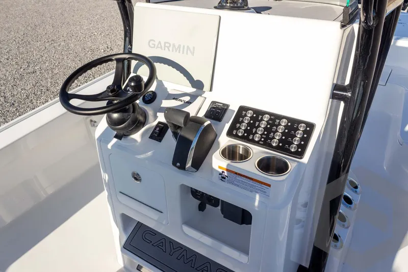 Slide: The Image of 2026 Caymas 26 HB boat console with Garmin navigation and control panel. - 44