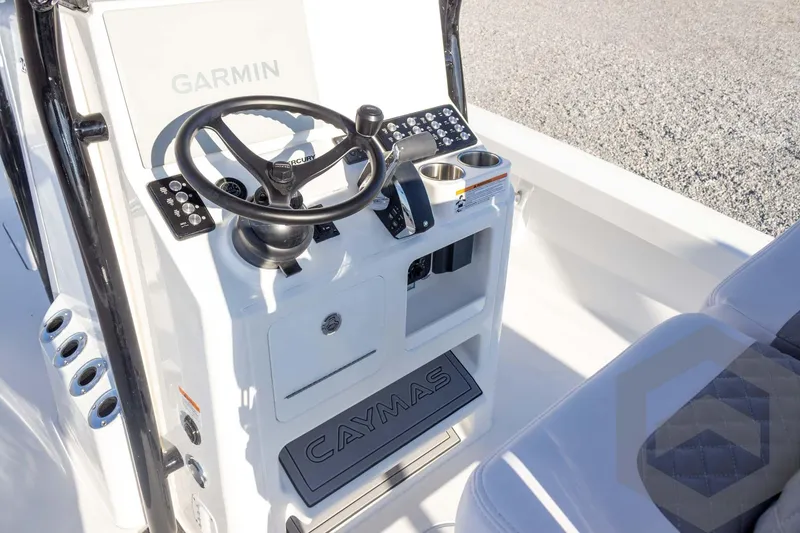 Slide: The Image of 2026 Caymas 26 HB boat console with Garmin navigation and steering wheel. - 45