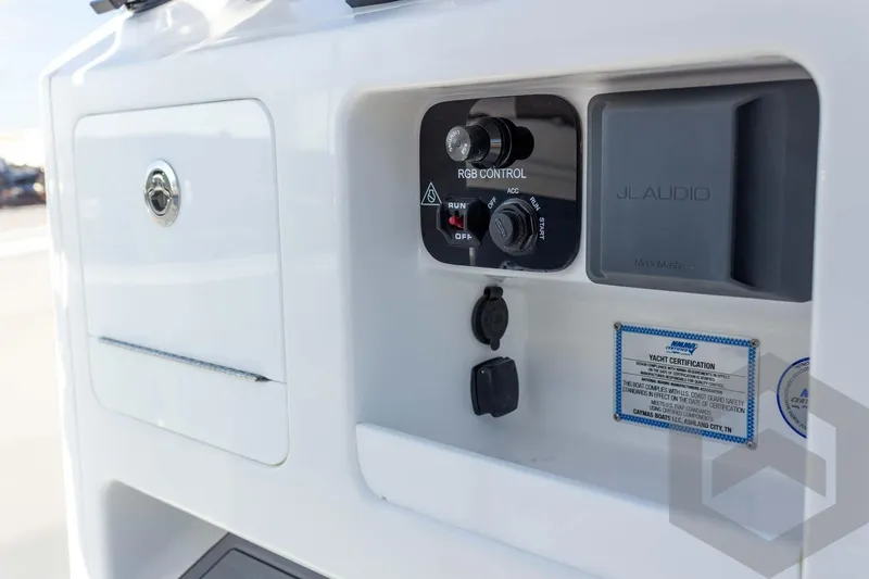 Slide: The Image of Control panel of 2026 Caymas 26 HB boat featuring RGB and JL Audio systems. - 50