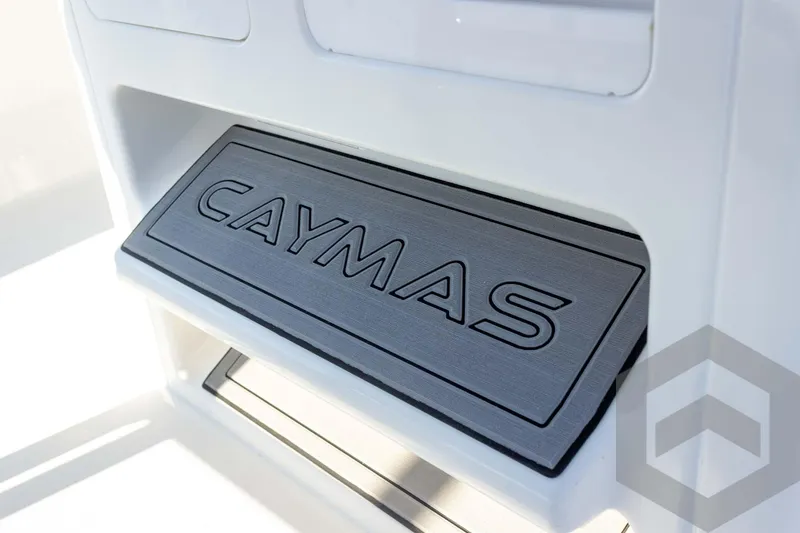 Slide: The Image of 2026 Caymas 26 HB boat detail with branded step mat. - 52