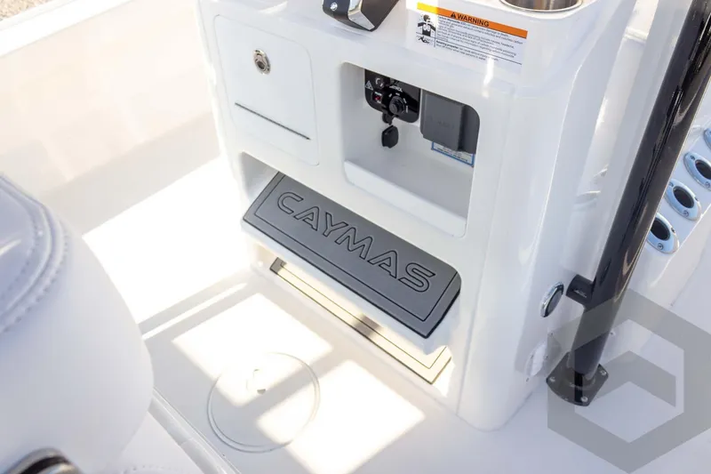 Slide: The Image of 2026 Caymas 26 HB boat interior with branded step and control panel. - 53