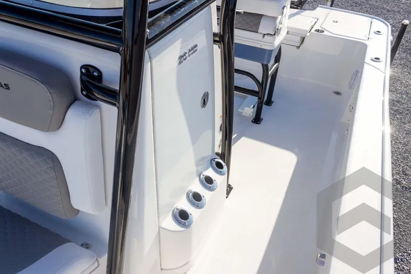 Slide: The Image of 2026 Caymas 26 HB boat interior with seating and rod holders. - 54