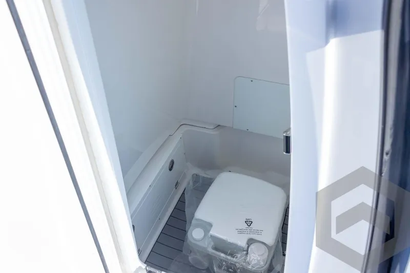 Slide: The Image of 2026 Caymas 26 HB boat interior with compact marine toilet. - 55