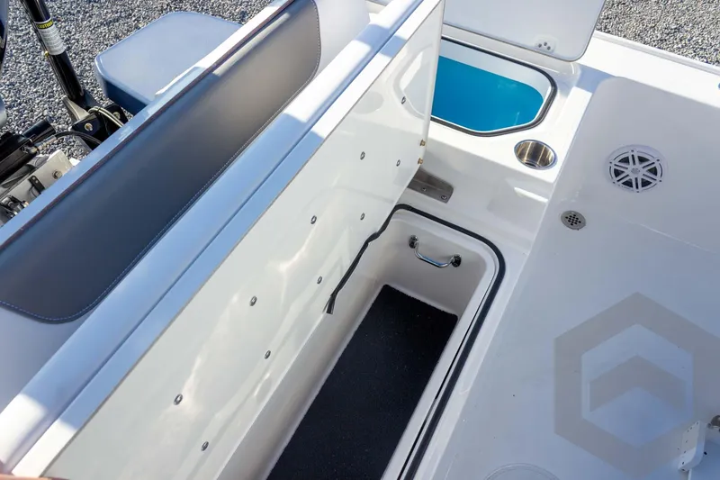 Slide: The Image of 2026 Caymas 26 HB boat interior with storage compartments and seating. - 60