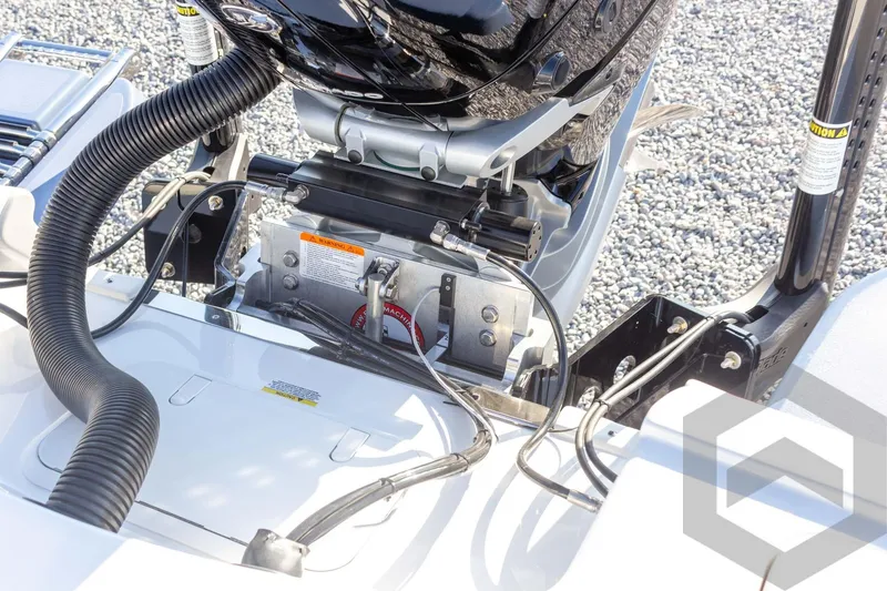 Slide: The Image of 2026 Caymas 26 HB boat engine compartment with cables and hydraulic components. - 62