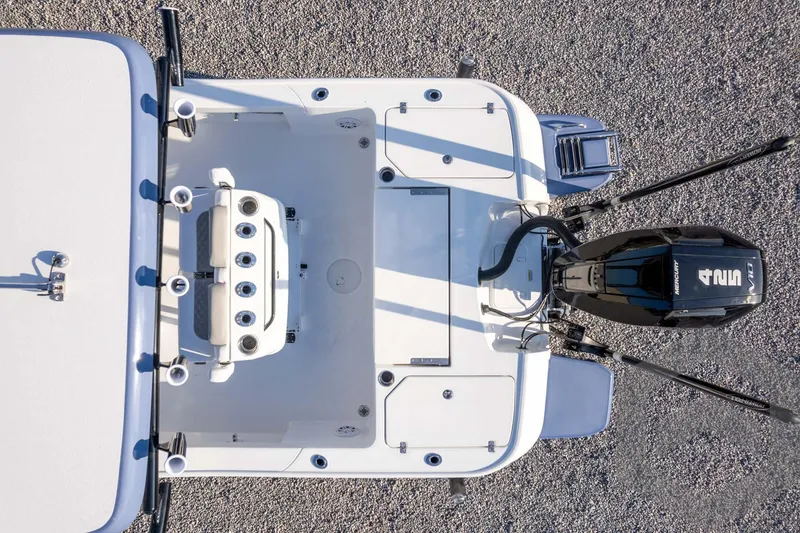 Slide: The Image of Top view of 2026 Caymas 26 HB boat with Mercury engine and fishing rod holders. - 68