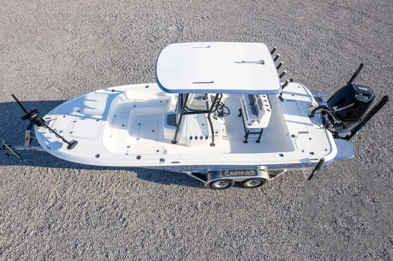 Slide: The Image of 2026 Caymas 26 HB boat on trailer, top view, white deck, dual engines. - 70