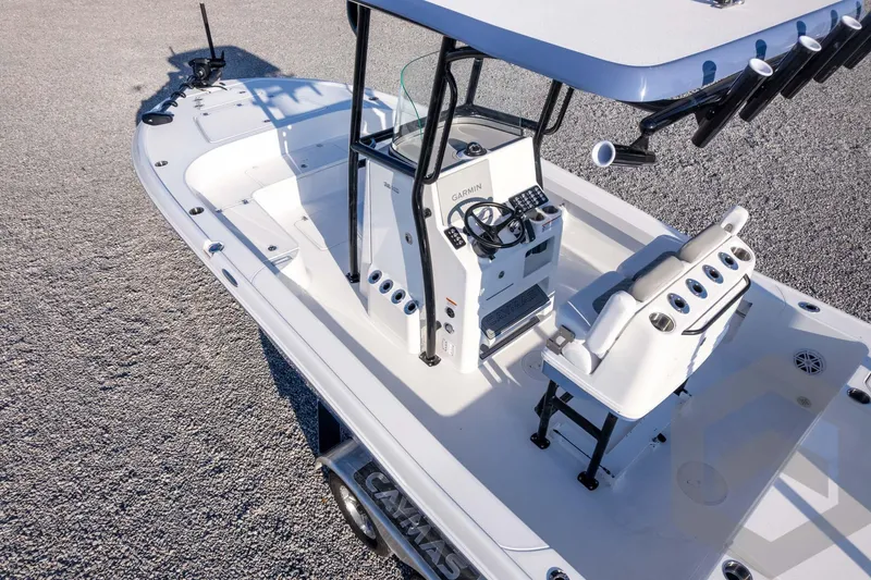 Slide: The Image of 2026 Caymas 26 HB boat with center console and seating, viewed from above. - 78