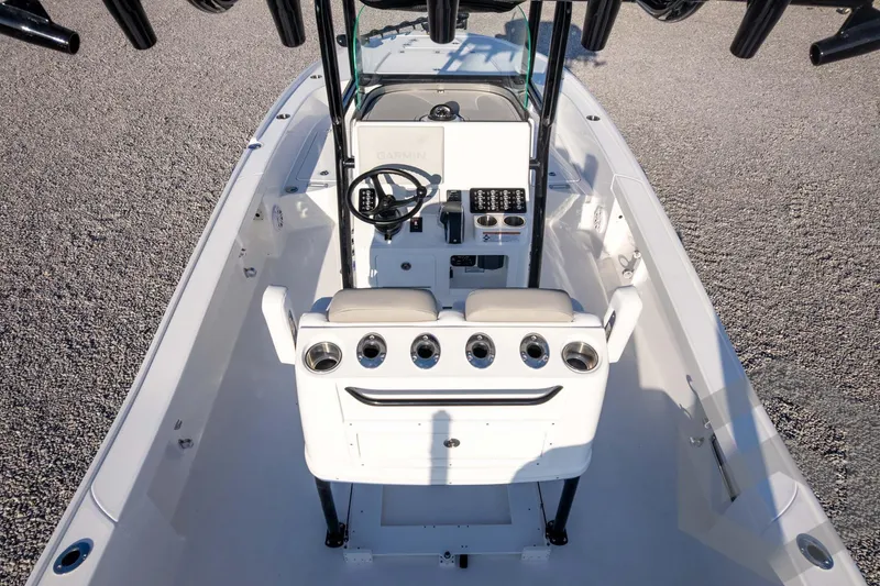 Slide: The Image of 2026 Caymas 26 HB boat interior with steering console and seating. - 79