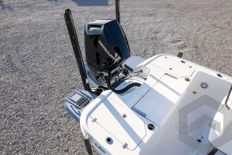 Slide: The Image of 2026 Caymas 26 HB boat with Mercury outboard engine, rear deck view. - 81