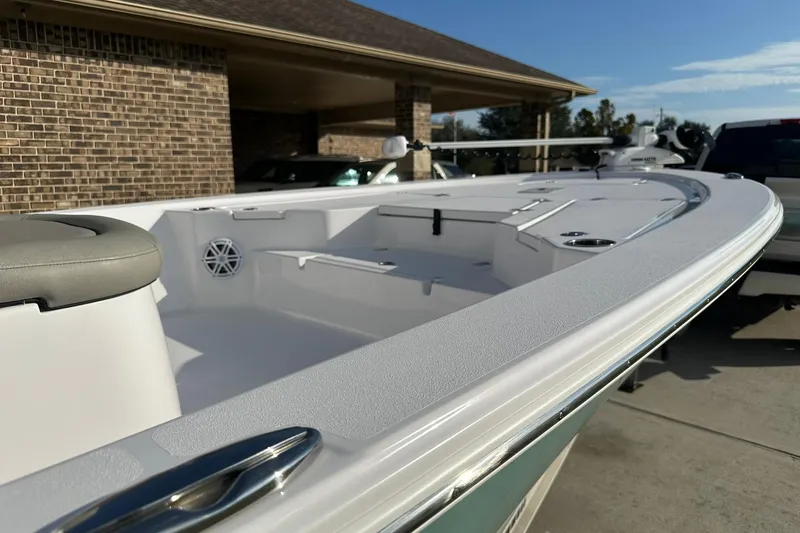 Slide: The Image of 2023 Sportsman Tournament 234 Bay Boat, sleek design, parked outdoors, showcasing spacious deck. - 17