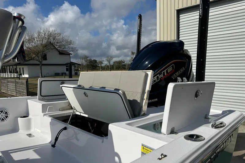 Slide: The Image of 2023 Sportsman Tournament 234 Bay Boat with Yamaha engine, open storage compartments. - 19