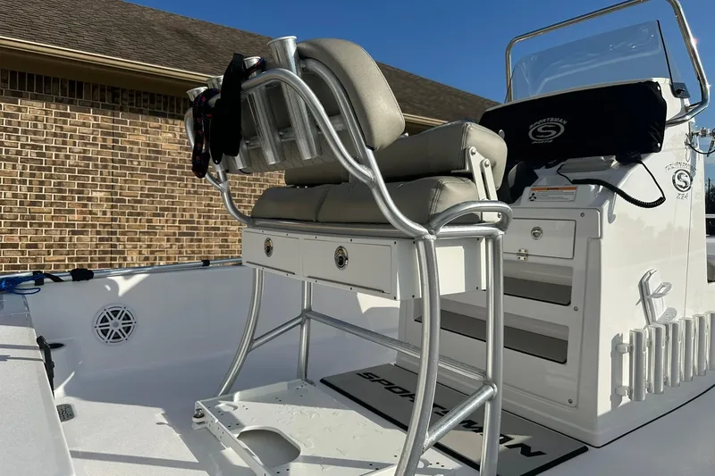 Slide: The Image of 2023 Sportsman Tournament 234 Bay Boat interior with seating and console details. - 24