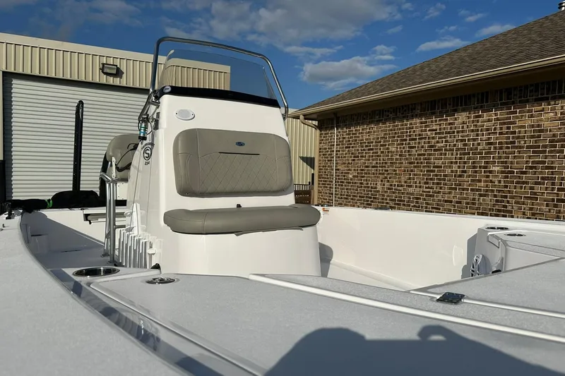 Slide: The Image of 2023 Sportsman Tournament 234 Bay Boat with sleek design, parked outdoors. - 27