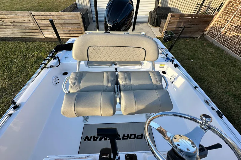 Slide: The Image of 2023 Sportsman Tournament 234 Bay Boat interior with dual seats and steering wheel. - 32