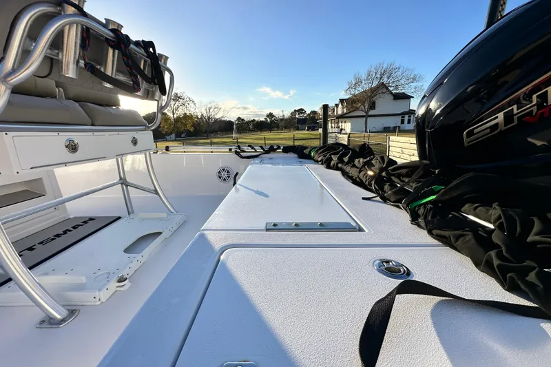 Slide: The Image of 2023 Sportsman Tournament 234 Bay Boat interior with seating and engine view. - 33