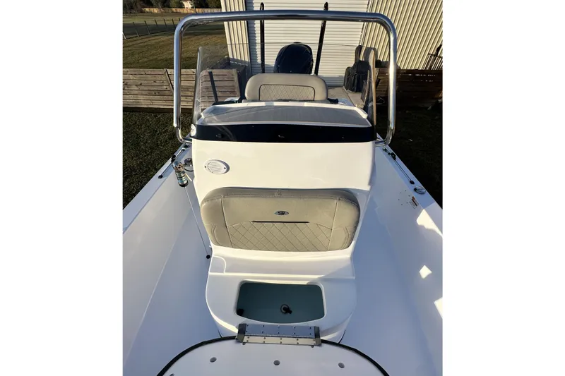 Slide: The Image of 2023 Sportsman Tournament 234 Bay Boat interior with seating and storage. - 52