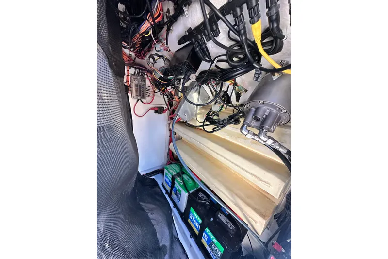 Slide: The Image of 2023 Sportsman Tournament 234 Bay Boat electrical system and battery compartment. - 55