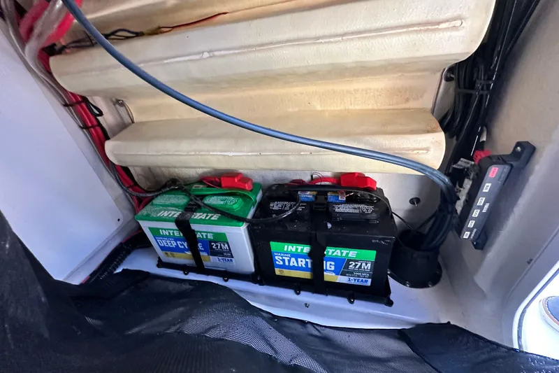 Slide: The Image of 2023 Sportsman Tournament 234 Bay Boat battery compartment with Interstate marine batteries. - 56