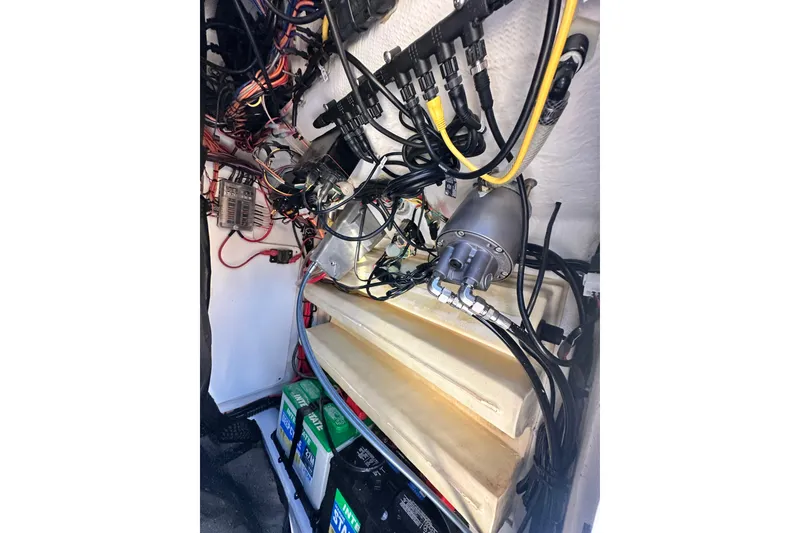 Slide: The Image of 2023 Sportsman Tournament 234 Bay Boat wiring and battery compartment. - 57
