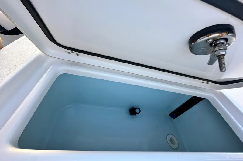 Slide: The Image of Open storage compartment on 2023 Sportsman Tournament 234 Bay Boat. - 68