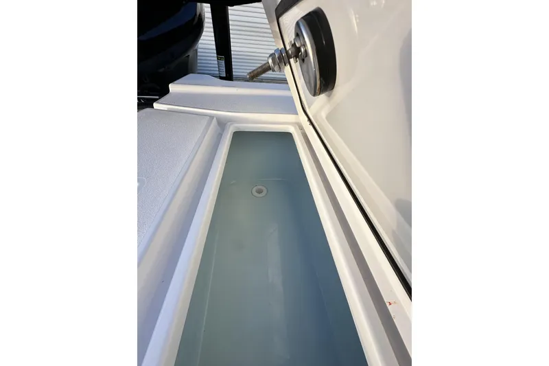 Slide: The Image of 2023 Sportsman Tournament 234 Bay Boat livewell interior view. - 71