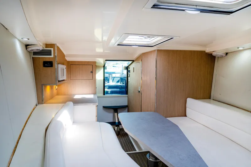 Slide: The Image of Interior of 2014 VanDutch 40 yacht with modern seating and wooden cabinetry. - 15