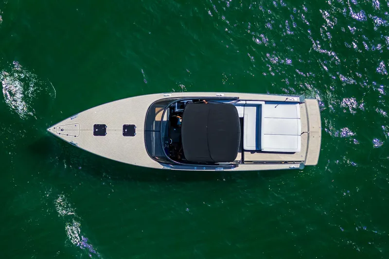 Slide: The Image of Aerial view of 2014 VanDutch 40 yacht on green water. - 6