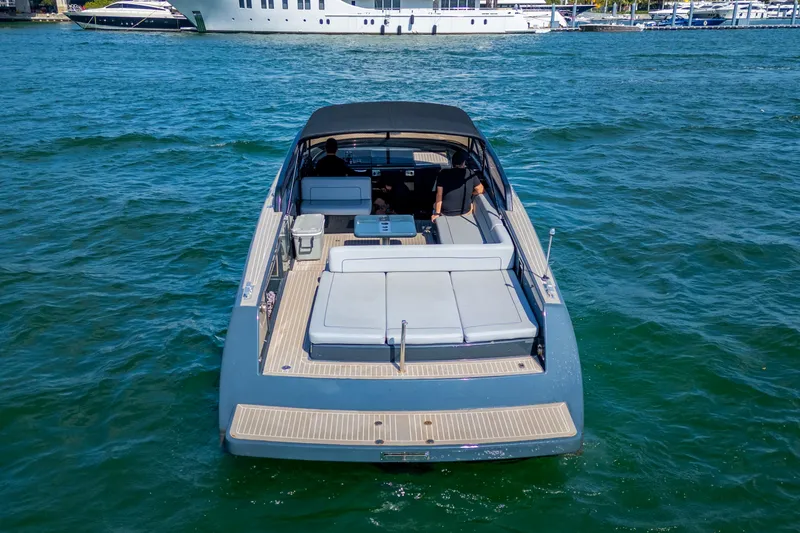 Slide: The Image of 2014 VanDutch 40 yacht cruising on open water, rear view. - 7