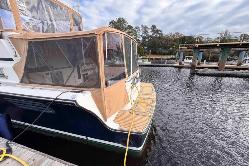 Slide: The Image of 2007 Albin 45 Command Bridge yacht docked at marina with tan canopy. - 12