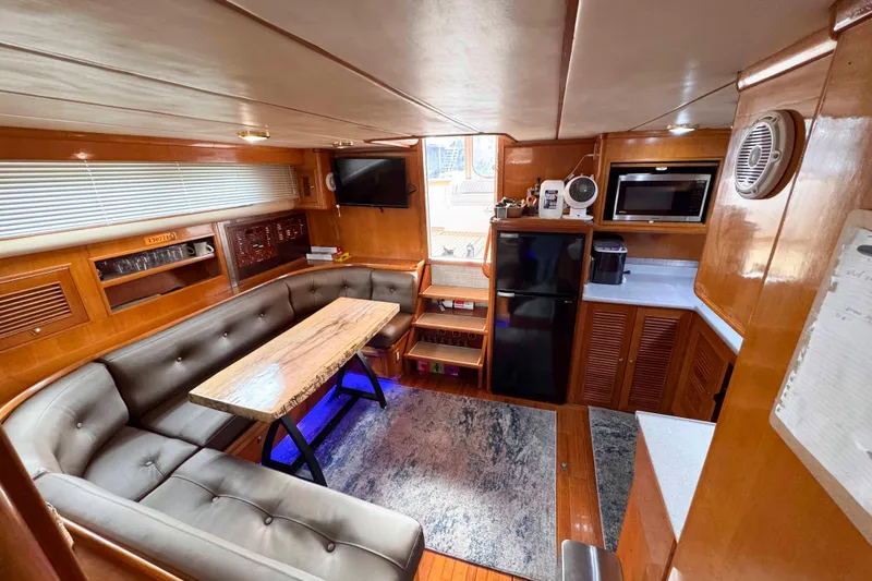 Slide: The Image of Luxurious interior of 2007 Albin 45 Command Bridge yacht with modern amenities and cozy seating. - 16