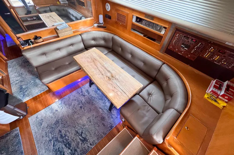 Slide: The Image of Luxurious interior of 2007 Albin 45 Command Bridge with plush seating and wooden table. - 18