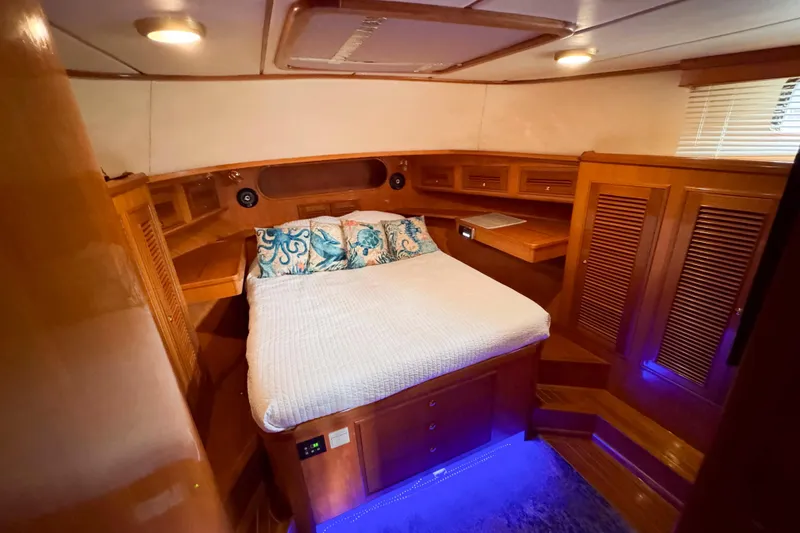 Slide: The Image of Luxurious cabin interior of 2007 Albin 45 Command Bridge with cozy bed and ambient lighting. - 23