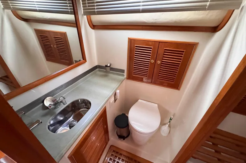Slide: The Image of Luxurious bathroom in 2007 Albin 45 Command Bridge yacht with modern fixtures. - 28