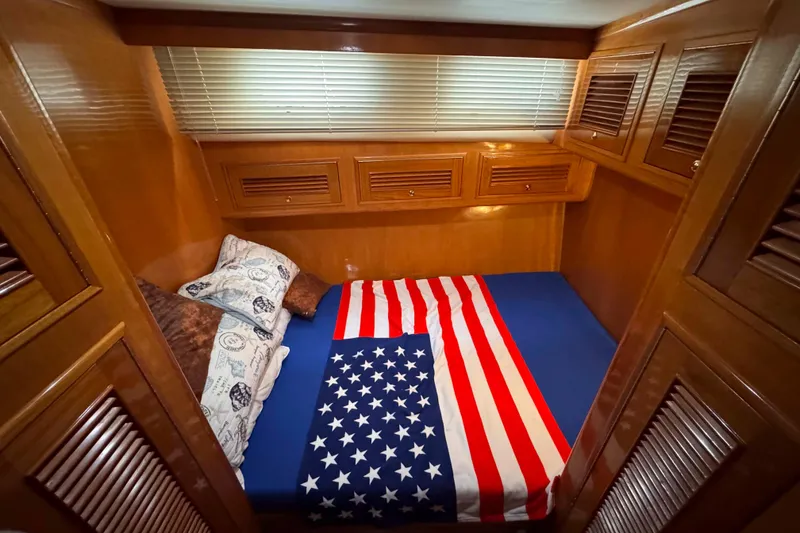 Slide: The Image of Cozy cabin interior of 2007 Albin 45 Command Bridge with American flag bedding. - 31
