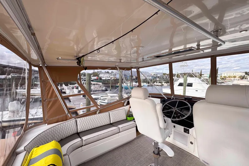 Slide: The Image of Interior of 2007 Albin 45 Command Bridge yacht with helm and seating area. - 4