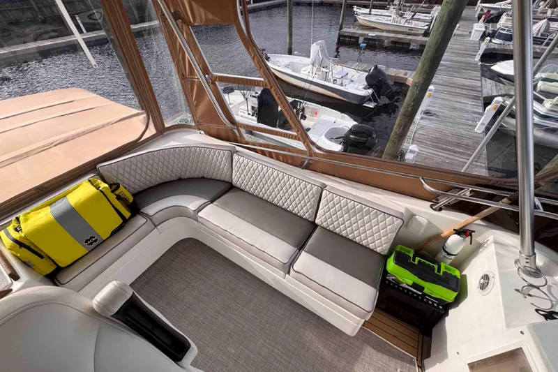 Slide: The Image of Luxurious seating area on 2007 Albin 45 Command Bridge yacht at marina. - 5