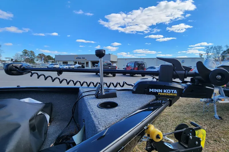 Slide: The Image of 2025 Tracker Pro Guide V-16 SC boat with Minn Kota PowerDrive motor in parking lot. - 7