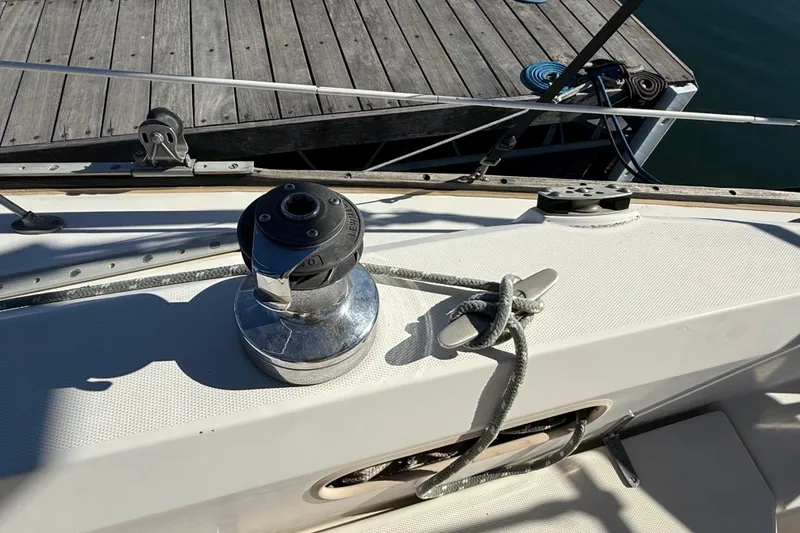 Slide: The Image of Winch and cleat on 1986 Sabre 30 MKIII sailboat deck near dock. - 13
