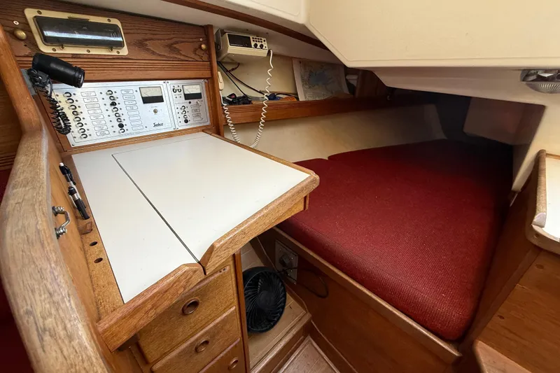 Slide: The Image of 1986 Sabre 30 MKIII yacht interior with navigation station and cozy berth. - 32