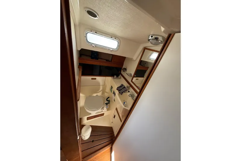 Slide: The Image of Interior of 1986 Sabre 30 MKIII sailboat bathroom with toilet and sink. - 36