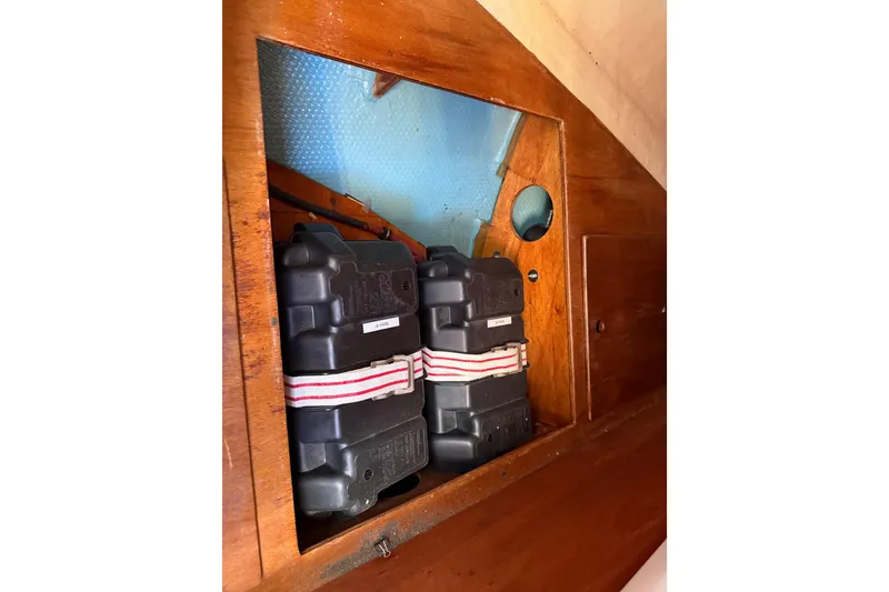 Slide: The Image of Battery compartment of 1986 Sabre 30 MKIII sailboat with wooden paneling. - 48