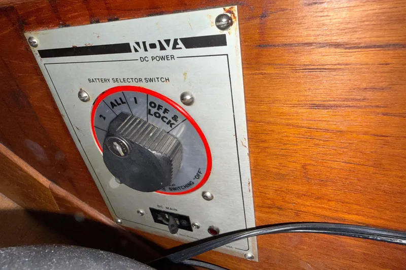 Slide: The Image of Battery selector switch on 1986 Sabre 30 MKIII, featuring Nova DC power panel. - 49